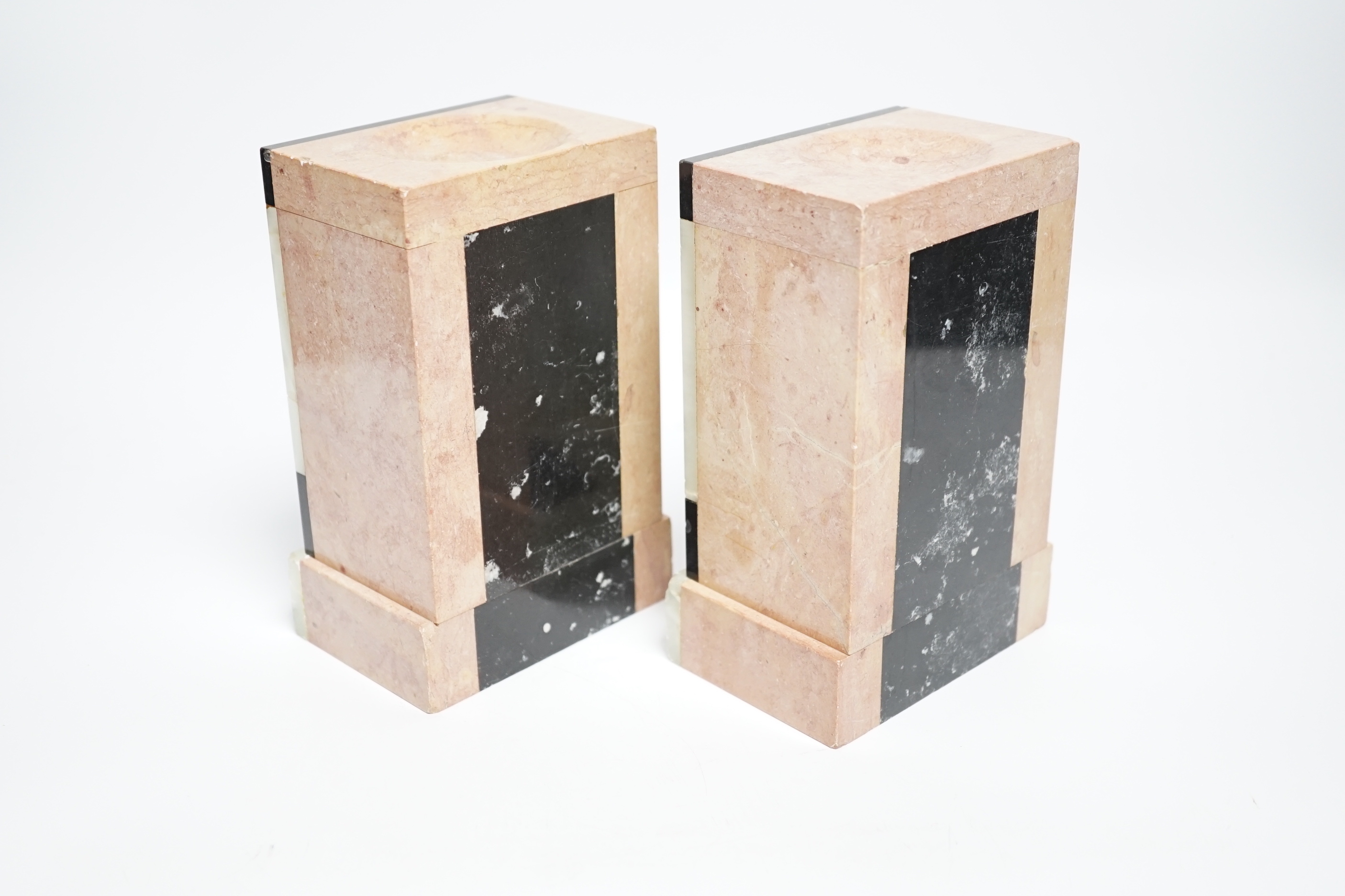 A pair of marble and onyx book-ends, 17cm high